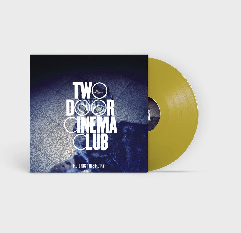 the album cover for Two Door Cinema Club - Tourist History - 15th Anniversary Edition [RSD Essentials Deluxe Gold 2LP]