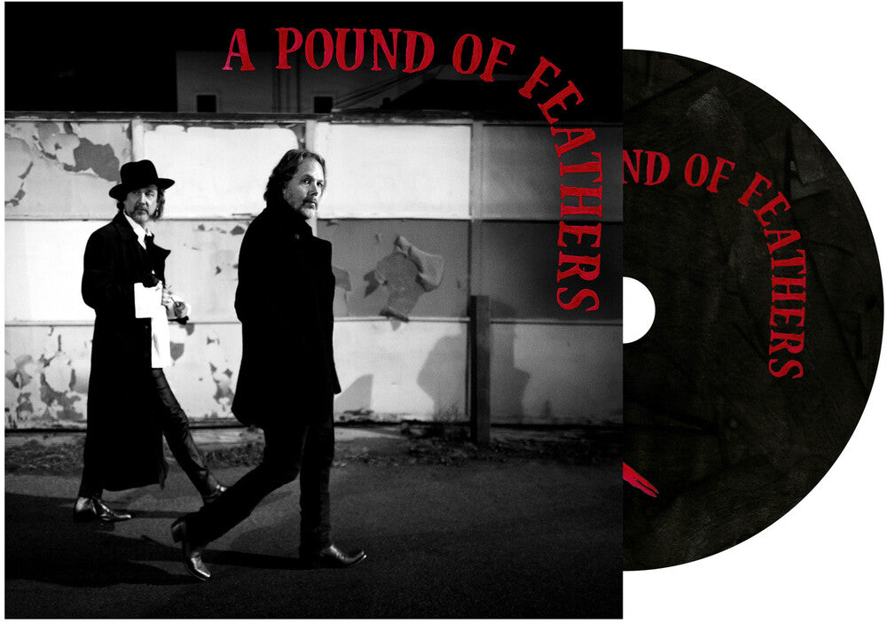 the album cover for The Black Crowes - A Pound Of Feathers