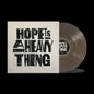 the album cover for Joy Oladokun - Hope Is A Heavy Thing [Transparent Black Ice]